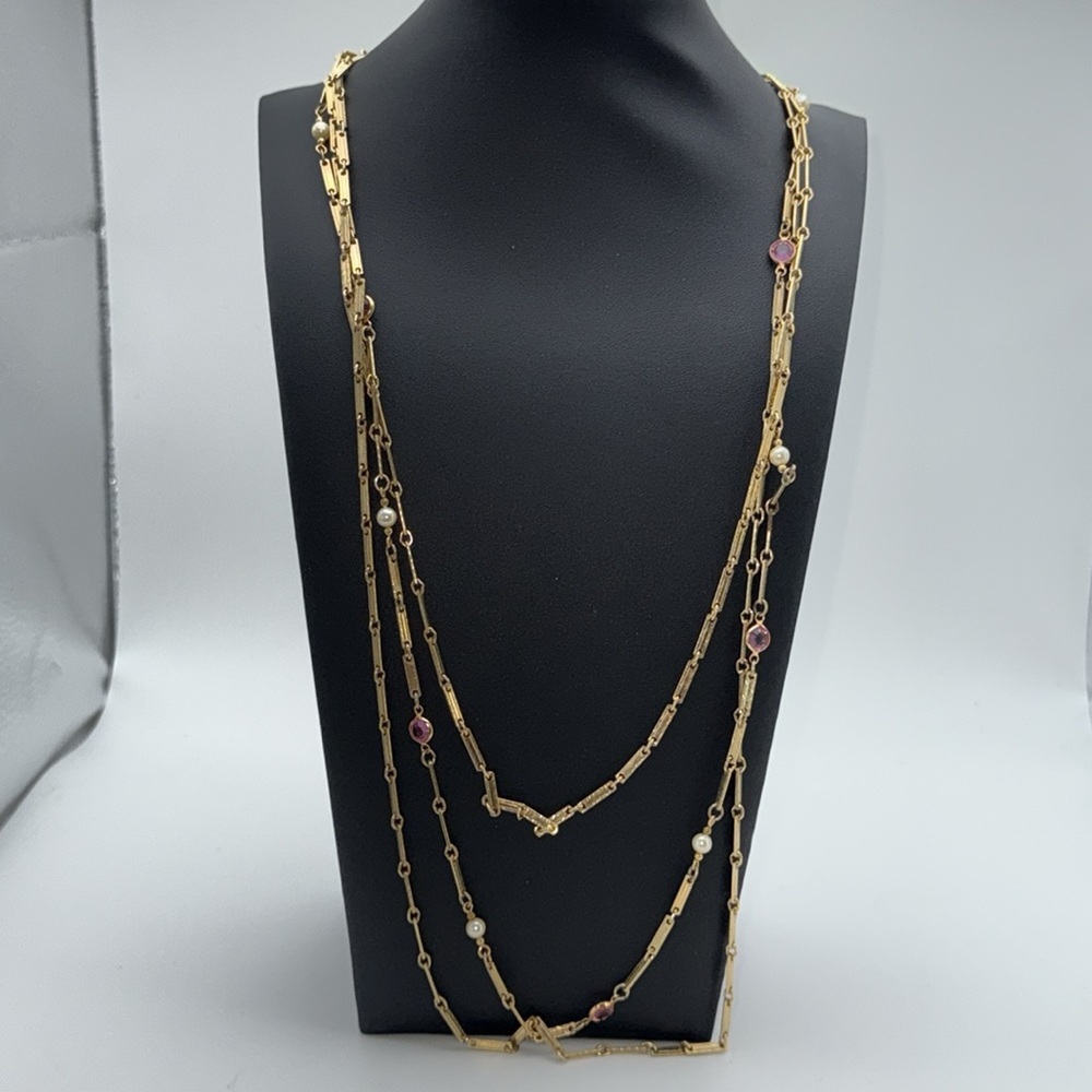 Triple strand gold tone unique necklace with pink colored “gems” / faux pearls